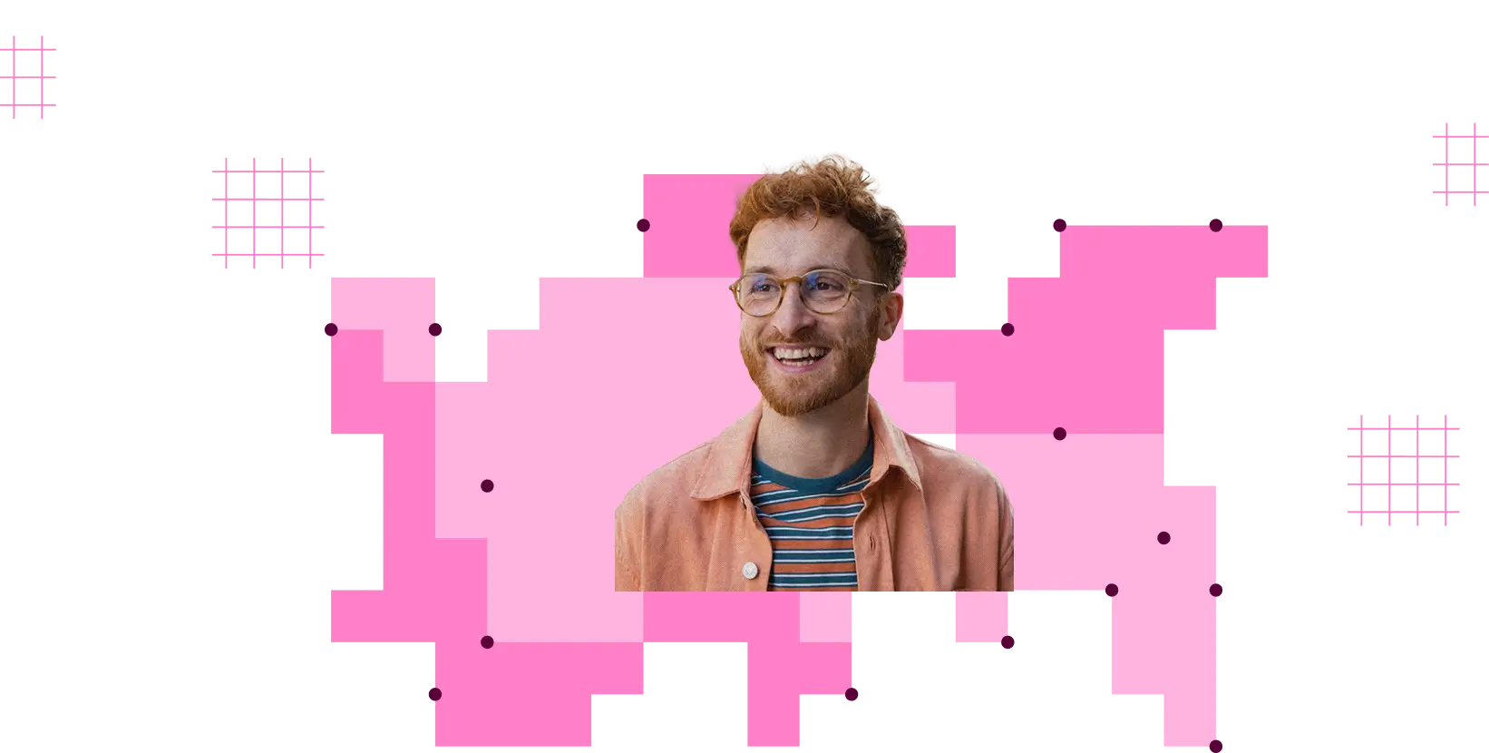 Smiling man with curly red hair, glasses, striped shirt, and peach jacket on pink geometric background.